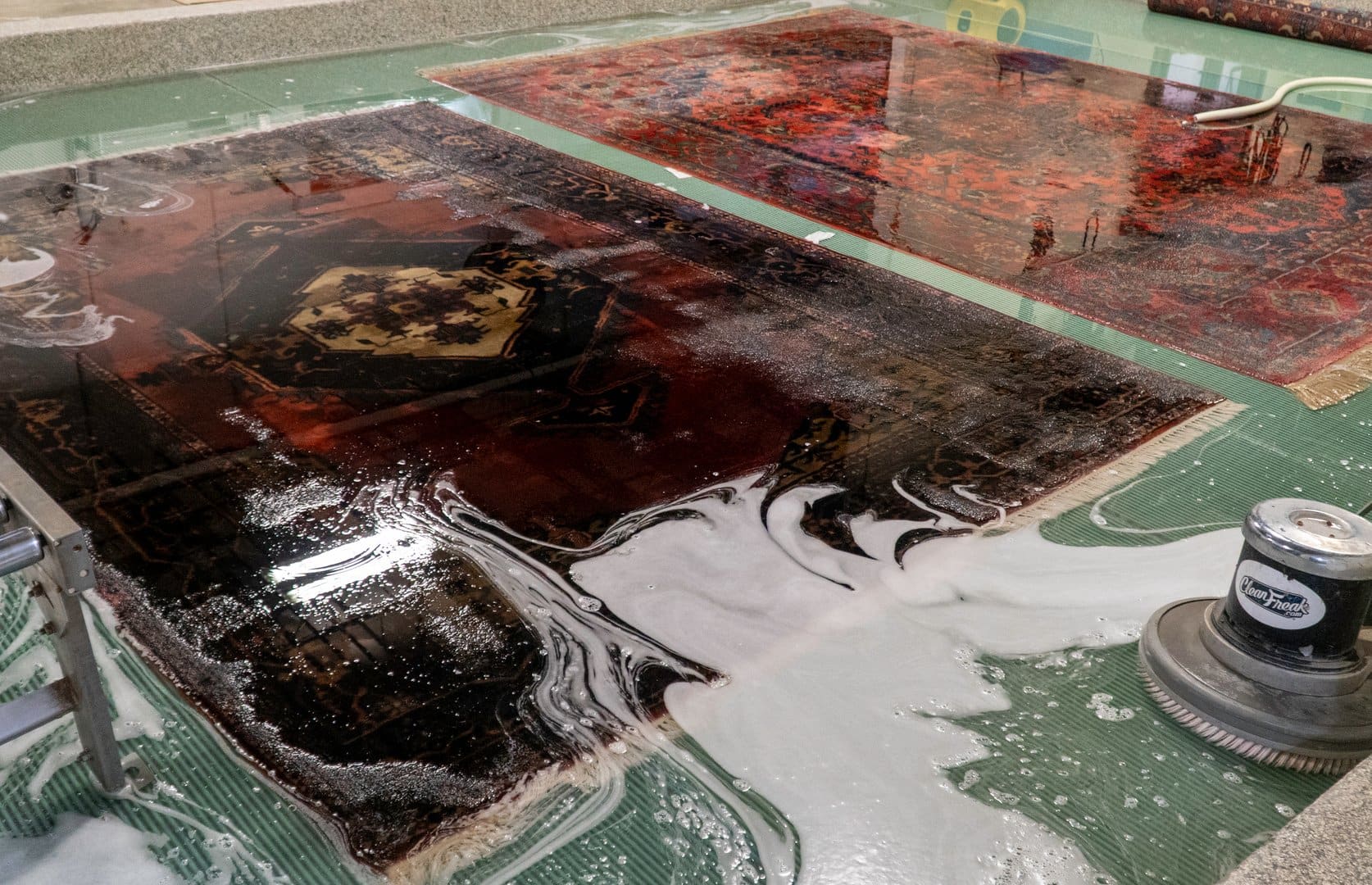 S&S Rug Cleaners expert team hand-washing Oriental rugs in Atlanta facility - professional rug cleaning specialists with 30+ years experience