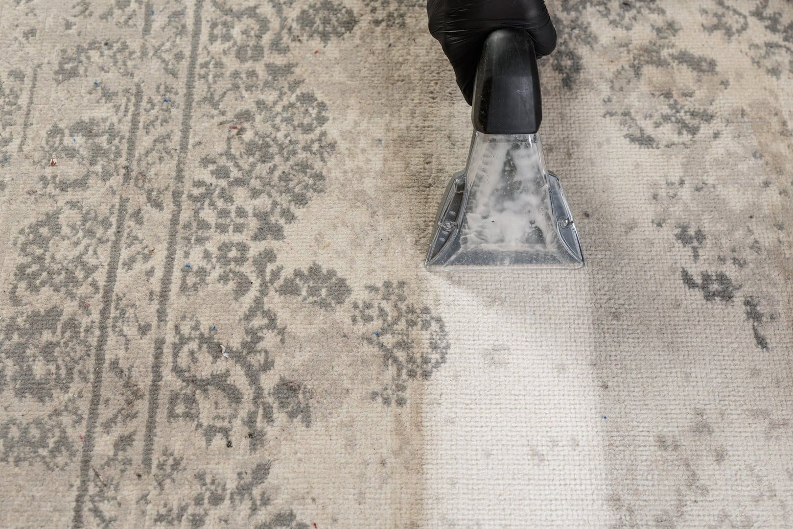 Before and after professional cleaning of a Persian rug