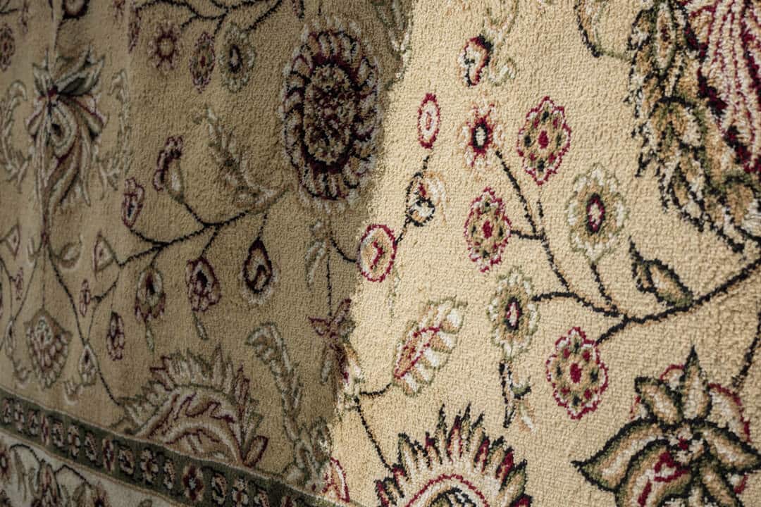 Before and after professional rug cleaning comparison - dirty vs clean area rug results in Atlanta